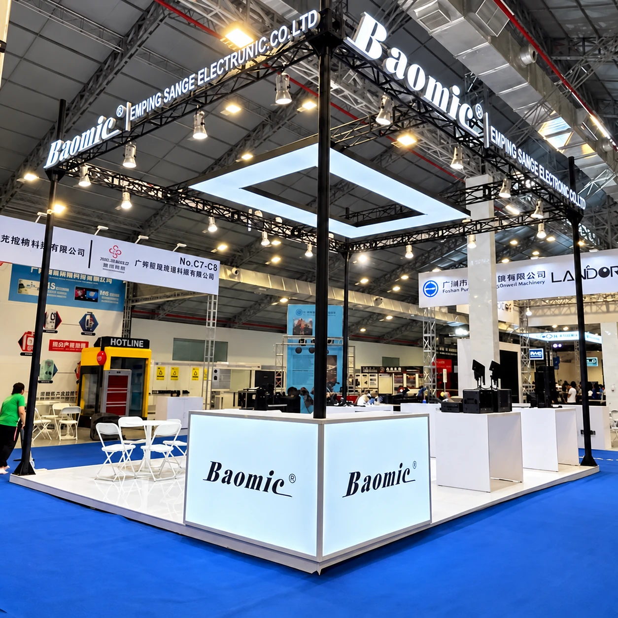 Baomic audio exhibition booth with a suspended black frame, spotlights and white product counters