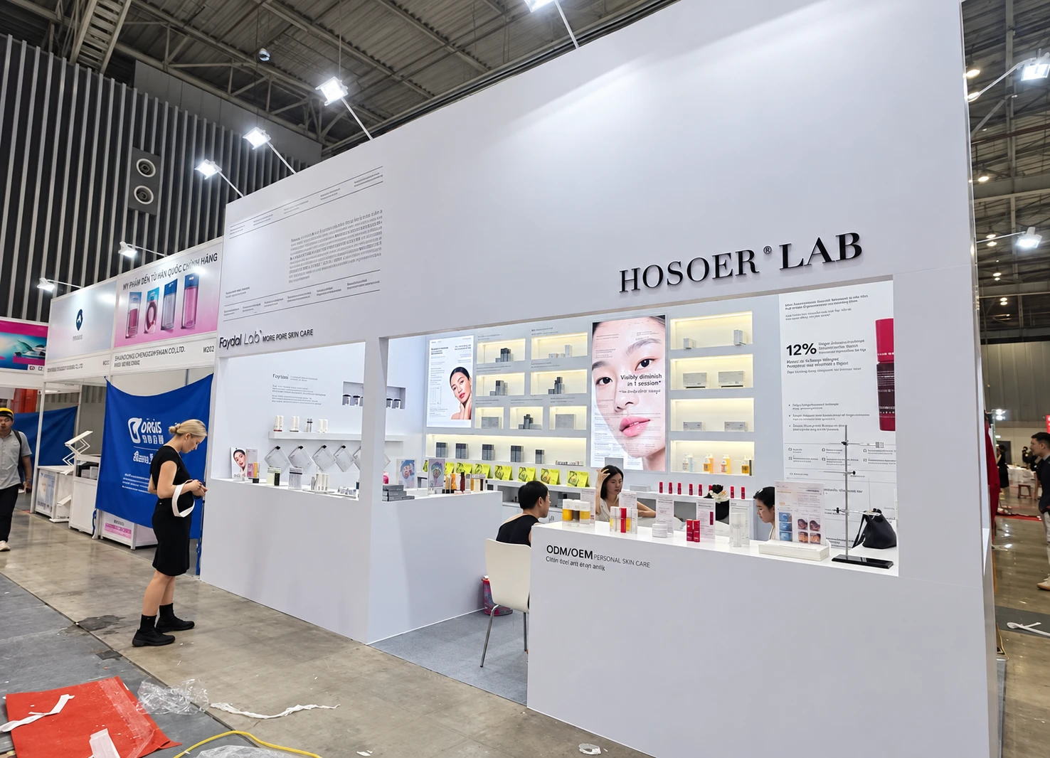 White HOSOER LAB beauty exhibition booth with illuminated product shelves, beauty imagery and reception counters