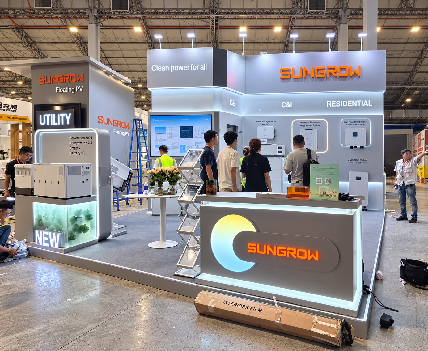 SUNGROW energy exhibition booth with a glowing reception counter, product displays and white overhead signage
